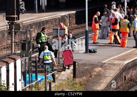 Undertakers recover the body of a suicide victim hit by a train at Clapham Junction Stock Photo