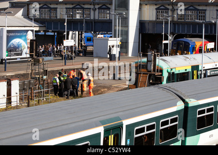 Undertakers recover the body of a suicide victim hit by a train at Clapham Junction Stock Photo