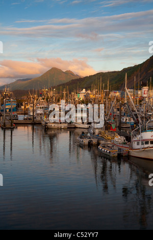 Sunrise over Saint Paul Boat Harbor with Pillar Mountain  to the right, Kodiak, Southwest Alaska, Summer Stock Photo