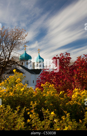 View of the Holy Resurrection Russian Orthodox Cathedral with colorful Fall foliage in the foreground, Kodiak Island, Alaska Stock Photo