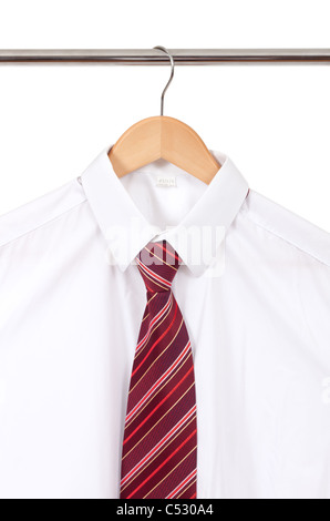 white shirt with a tie on a wooden hanger Stock Photo