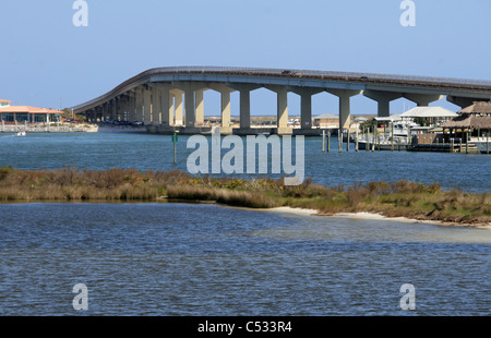 orange beach alabama intercoastal waterway bridge leading to Gulf of Mexico waters with small island and sandbar Stock Photo