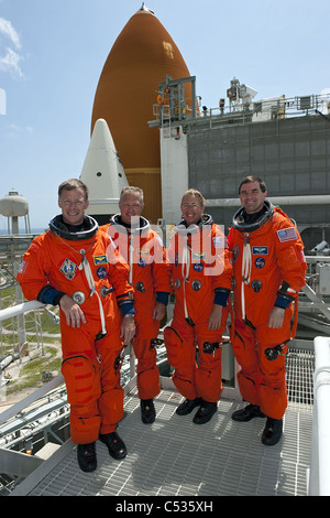 The final mission of Space Shuttle crew Atlantis pose for a picture on the launch pad of Kennedy Space Center Stock Photo