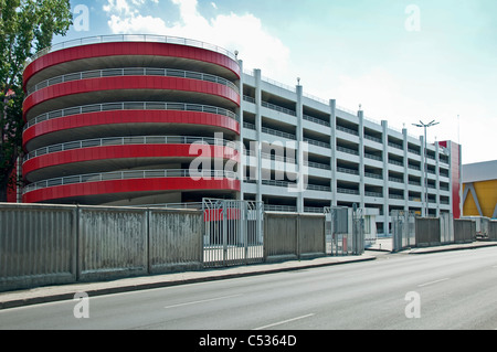 Modern five level parking garage. Red and white walls Stock Photo