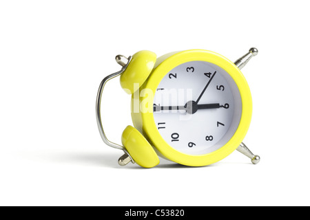 Alarm clock lying on its side on white background Stock Photo