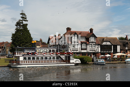 Southern Comfort paddle steamer, moored outside the Swan Inn at Horning, Norfolk Broads, UK Stock Photo