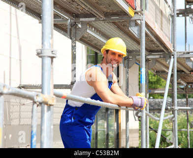 Manual worker on construction site. Stock Photo