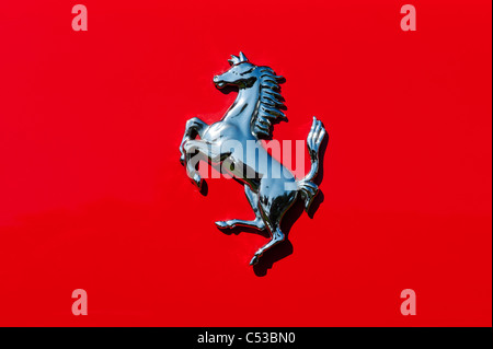 Chrome Ferrari prancing horse badge on the back of a red F355 GTS Stock Photo