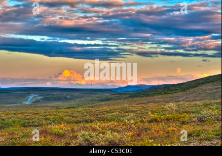 Moon rising and Mount Drum at sunset along the Denali Highway, Southcentral Alaska, Autumn. HDR Stock Photo