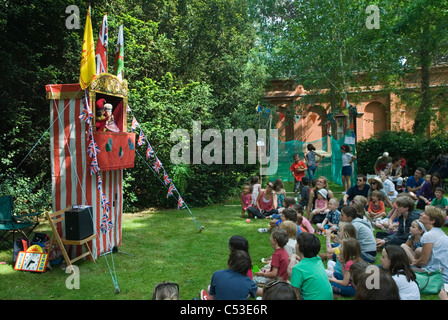 Punch and Judy Show at Petersham village fete Richmond Surrey. UK.  2011 2010s HOMER SYKES Stock Photo