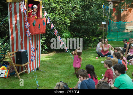 Punch and Judy Show at Petersham village fete Richmond Surrey. UK. 2011 2010s HOMER SYKES Stock Photo