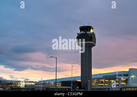 View of the control tower at the Ted Stevens Anchorage International Airport at sunset, Southcentral Alaska, Winter. HDR Stock Photo