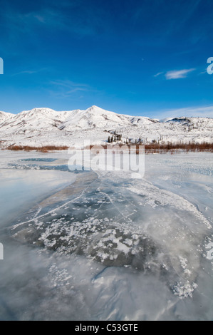 Overflow ice on the North Fork of the Koyukuk River, Brooks Range in the background, Gates of the Arctic National Park, Alaska Stock Photo