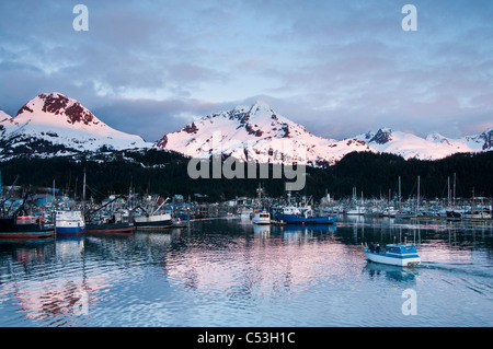 Scenic view of the Cordova small boat harbor and alpenglow on the Chugach mountains, Orca Inlet, Southcentral Alaska, Spring Stock Photo