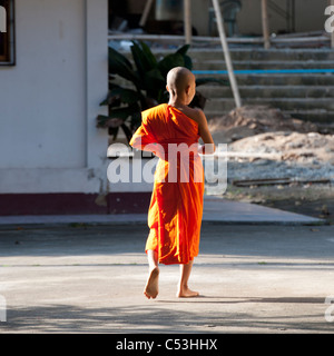 Rear view of a novice monk at Wat Sri Soda, Chiang Mai, Thailand Stock Photo