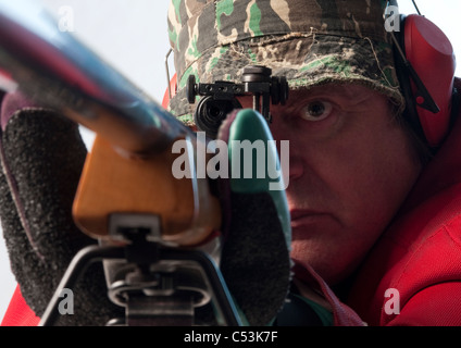 Shooter and rifle. Full bore target rifle NRA style prone position shooting Stock Photo