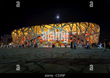 Spectators leaving the Birds Nest Stadium at night during the Summer Olympic games August 16, 2008 Beijing, China. Stock Photo