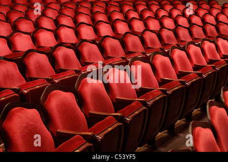 Rows of red velvet seats in a movie theater Stock Photo - Alamy