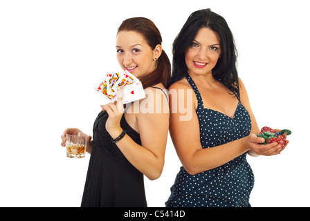 Casino beautiful women holding poker chips and cards isolated on white background Stock Photo