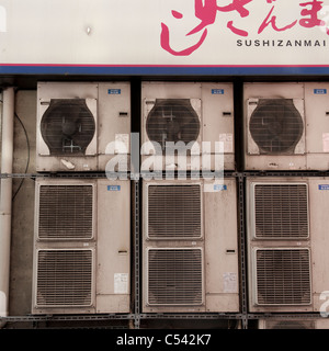 Air conditioners mounted on a wall, Ginza, Chuo Ward, Tokyo, Japan Stock Photo