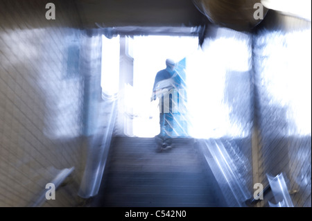 Passenger moving up on stairs of subway station, Ginza, Chuo Ward, Tokyo, Japan Stock Photo