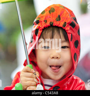 Portrait of a baby boy wearing a raincoat, Tokyo, Japan Stock Photo