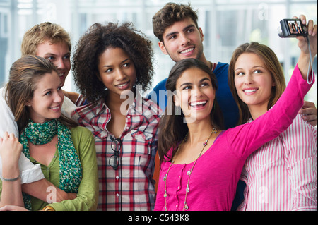 Multi-ethnic university students taking photos of themselves Stock Photo