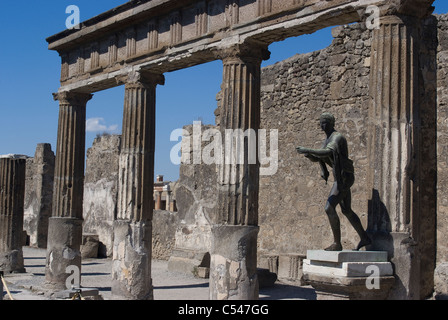 Temple with statue of Apollo at the Forum of the ancient ruins of the Roman city of Pompeii, Campania, Italy Stock Photo