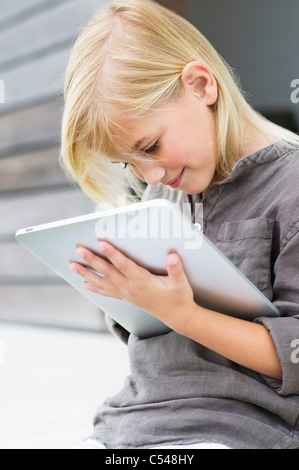 Girl using a digital tablet Stock Photo