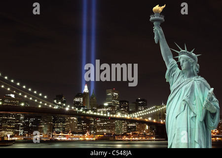 Lower Manhattan Skyline, the Statue of Liberty and the Towers Of Lights at Night Stock Photo