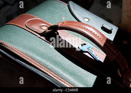 Abandoned key and suitcase Stock Photo