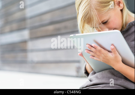 Girl using a digital tablet Stock Photo