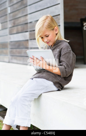 Girl using a digital tablet Stock Photo