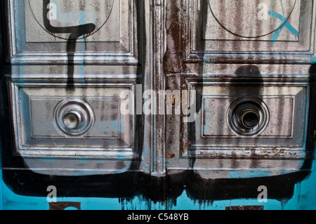 Graffiti on a door, Malasana, Madrid, Spain Stock Photo