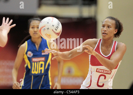 06.07.2011 Serena Guthrie of England(right) in action during the Pool D match between England VS Malaysia, Mission Foods World Netball Championships 2011 from the Singapore Indoor Stadium in Singapore. Stock Photo