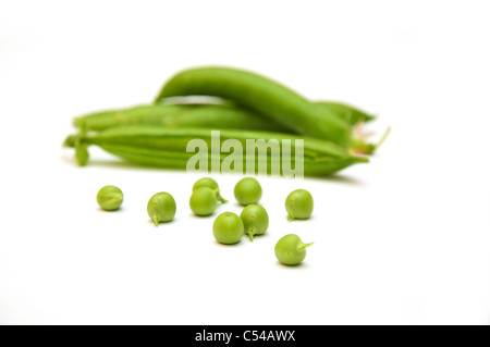 Green peas pods over a white background Stock Photo