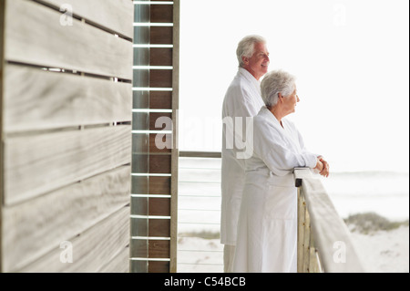 Senior couple standing at a balcony Stock Photo