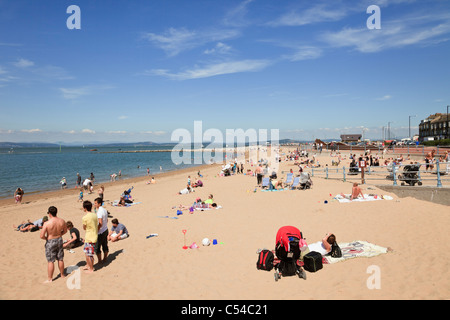 Morecambe, Lancashire, England, UK, Britain. People on sandy beach in seaside resort on north west coast. Stock Photo