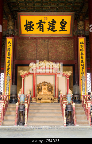 Throne in The Hall of Preserving / Preserved Harmony – Bao He Dian – inside the Forbidden City in Beijing, China. Stock Photo