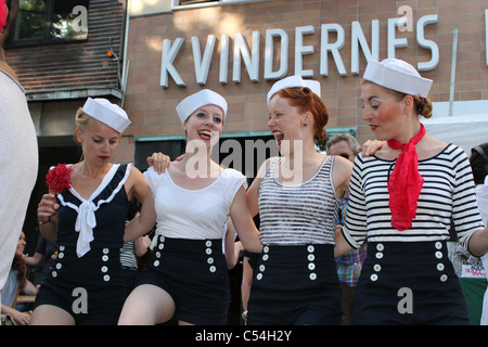 Women dressed in sailor outfits learning how to dance swing at Copenhagen Jazz Festival July 2011 Stock Photo