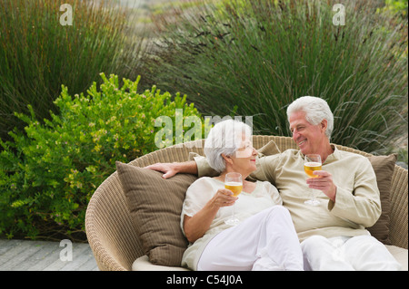 Senior couple toasting with wine Stock Photo