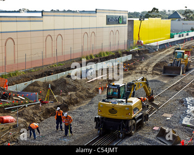Workers inspecting excavation work during railway upgrade Stock Photo