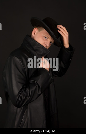 Special agent in black coat Stock Photo