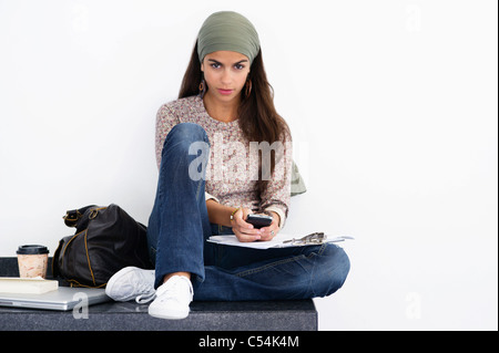 length portrait against a white background of a woman with green body paint  dressed up in a witch costume for Halloween making a scary face at camera  Stock Photo - Alamy