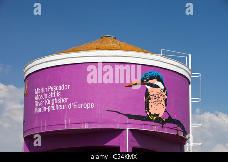 A water storage tank painted with a Kingfisher to show the areas importance to wildlife in Isla Major, a town in the Coto Donana Stock Photo