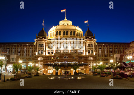 The Netherlands, Scheveningen near The Hague, hotel called Grand Hotel Amrâth Kurhaus. Dusk. Stock Photo