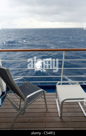Chair and a stool on the deck of cruise ship Silver Shadow, East China Sea Stock Photo