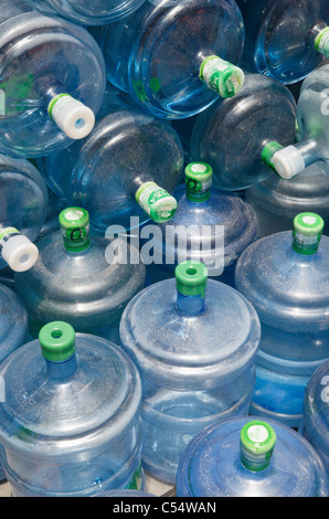 Large blue water bottles stacked in Hong Kong Stock Photo