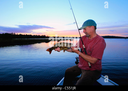 Mature man bass fishing in a lake Stock Photo