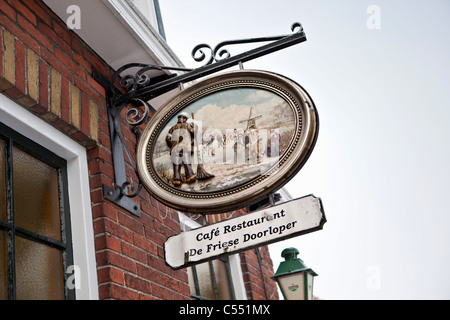 The Netherlands, Hindeloopen, Dutch capital of ice skating culture. Outdoor sign of restaurant of Skating or Skate Museum. Stock Photo